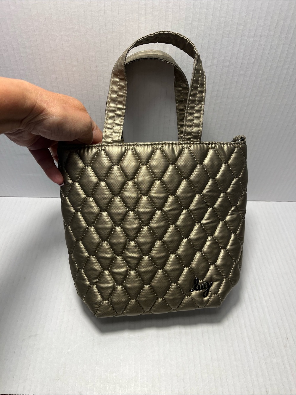 Lug Tip Toe Bag in Metallic Champagne- No crossbody Strap